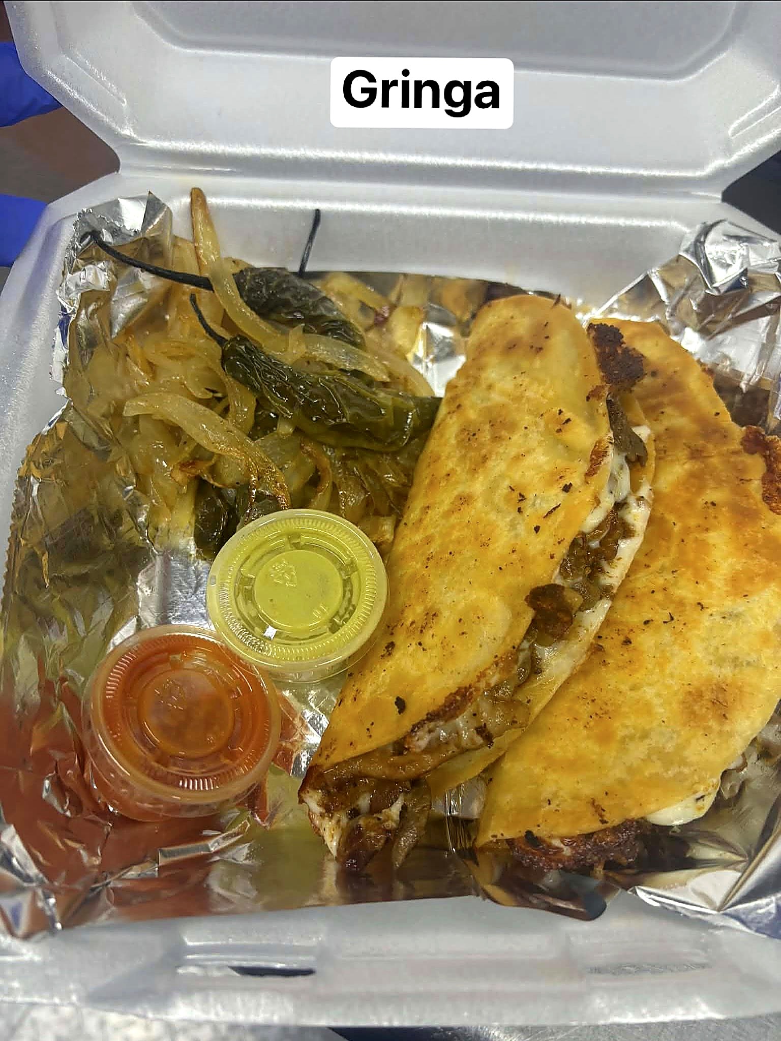 Gringas with pastor, fajita, chorizo, and bacon, grilled onion and chile toreado on the side